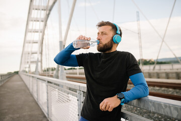 the young athlete dehydrates with water after training
