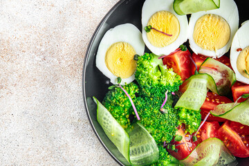 buddha bowl fresh salad boiled egg, broccoli, tomato, cucumber, vegetables meal snack on the table copy space food background rustic keto or paleo diet veggie vegan or vegetarian food no meat