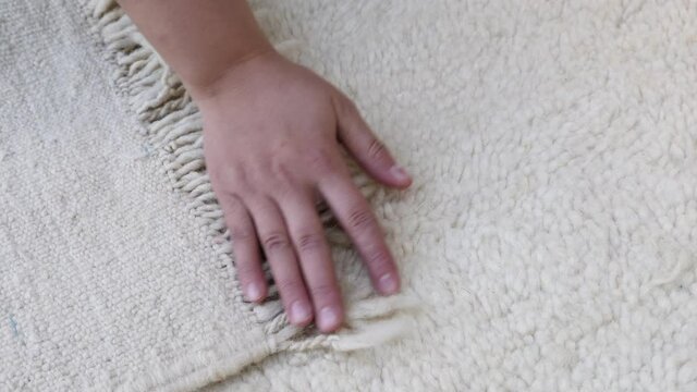 Authentic traditional handmade Moroccan Berber carpet in Beni Ourain style. Morocco home decor, texture background footage.