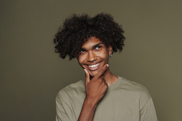 Fototapeta na wymiar Young black man with piercing smiling and looking upward