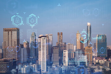 Glowing hologram of technological process, aerial panoramic cityscape of Bangkok at sunset. The...