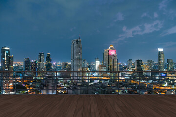 Panoramic Bangkok skyline view, wooden observatory deck on rooftop, night time. Asian corporate and residential lifestyle. Financial city downtown, real estate. Product display mockup empty roof