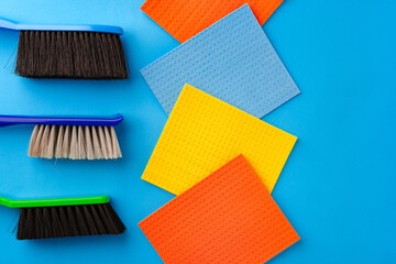 House cleaning supplies on blue color background