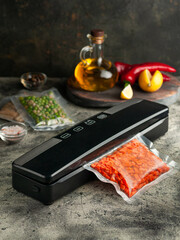Vacuum packing machine. For long-term storage of food. Top view dark background.