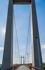 High pillars to support a bridge over the river. Construction and infrastructure of road bridges.- concept.