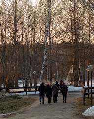 Russia. Spring. Morning. Sanatorium Lunevo. View of people walking along the path.