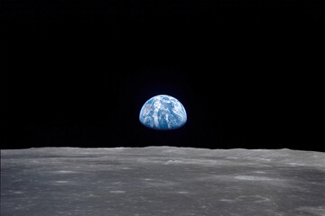 The 'Earthrise' seen from the moon. Digital enhancement. Elements of this image furnished by NASA - obrazy, fototapety, plakaty