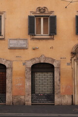 Fototapeta na wymiar Via delle Botteghe Oscure Street View with House Facade Close Up in Rome, Italy