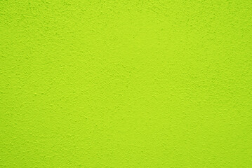 Naklejka na ściany i meble Seamless texture of lime green cement wall a rough surface, with space for text, for a background..