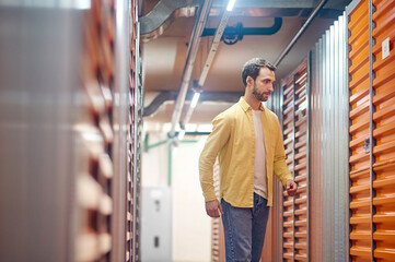 Man coming up to closed box door