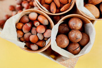 Assorted nuts in box nuts: pecan, almond, macadamia, brazil, cashew, hazelnut, Rich in minerals and protein. Healthy nutrition, high in zinc, magnesium and vitamins, online ordering, shoping concept.