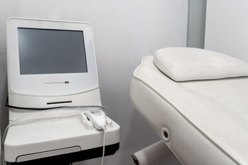 Medical apparatus for ultrasound therapy, massager, in the office of the clinic, for sick patients. Close-up.