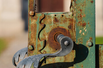 Old rusty metal lock of the door to the secret garden