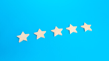Five rating stars. Rating evaluation concept. High satisfaction. Popularity of restaurants, hotels or mobile applications. Highest score. Service quality feedback. Good reputation.
