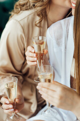 Young people in club or bar drinking cocktails and having fun