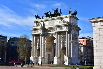 Fototapeta na wymiar MILAN, DECEMBER 28, 2017 - The Arch of Peace (Arco della Pace) in a sunny winter day with blue sky - city gate in the centre of the Old Town of Milan, Sempione Park 