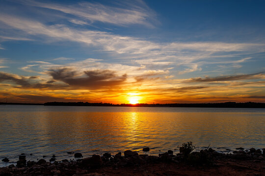 Beautiful cloudy sunset at Thunderbird lake. © crotonoil