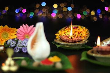 Diya Or Deep Lit In Leaf bowls On Called Patravali or Pattal Dona Katori Decorated With Paan Shankh...