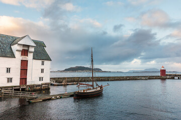 Fototapeta na wymiar Traditional fishing boat moored in the harbour at Molovegen, Ålesund, Møre og Romsdal, Norway
