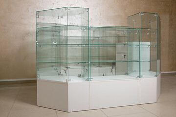 counter for retail sale of goods in a store made of glass and wooden panels. Equipment forsale of...