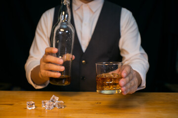 Barman pouring whiskey whiskey glass beautiful night