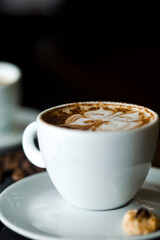 Coffee cup and coffee beans at a coffee shop. Still details. High quality photo