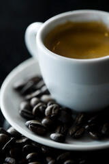 Coffee cup and coffee beans at a coffee shop. Still details. High quality photo
