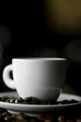 Coffee cup and coffee beans at a coffee shop. Still details. High quality photo