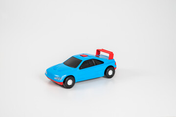 Fototapeta na wymiar Toy plastic car isolated on white background.
