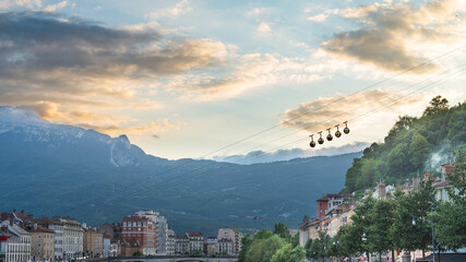 The silhouette of the famous cablecar in Grenoble, France, crossing the picture in diagonal....