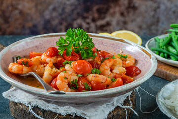 Jumbo king prawn with tomatoes and garlic garnished with fresh parsley