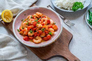 Jumbo king prawn with tomatoes and garlic garnished with fresh parsley