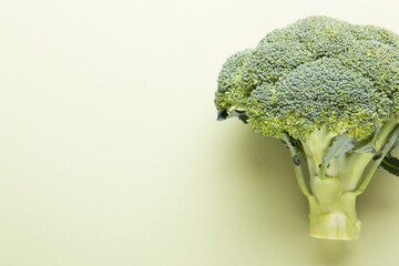 Broccoli vegetables on a green background. Asparagus cabbage.