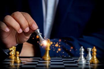 Businessman holding silver chess to use competitor's business strategy for future victory. Chess...