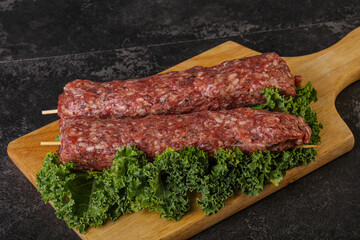 Raw minced beef kebab skewer