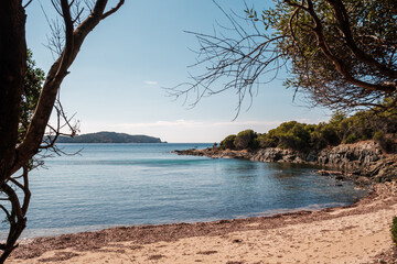 The secluded beach of Plage de Chiuni and turquoise Mediterranean sea on the west coast of Corsica