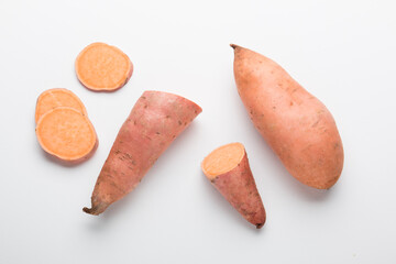 Sweet potato vegetable on a white background. Sliced ​​sweet potato. In the Cut.