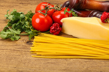 Raw Italian spaghetti heap with cheese