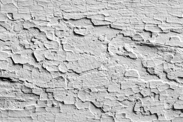 Old weathered background with cracked paint in black and white