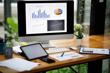 Financial Businesswomen analyze the graph of the company's performance to create profits and growth, Market research reports and income statistics, Financial and Accounting concepts.
