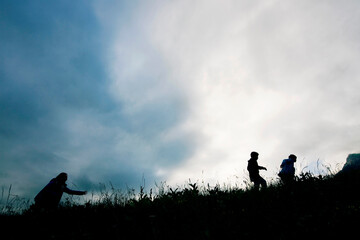 Fototapeta premium Boys and girls play and run on the mountain