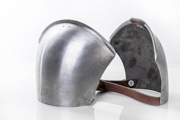 Steel metal shoulder pads to protect torso. Iron steel ammunition, personal accessories for a knight: helmet, chain mail, limb protection. concept is a reconstruction of battles.
