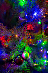 Obraz na płótnie Canvas Christmas sparkling toys with illumination. Decorative toys on Christmas tree. concept is Christmas Night.