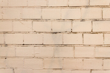 Obraz premium Old Wall Made Of Red Brick, Painted White In Loft Style. Background of white building bricks. Wall is made of white building blocks with elements cement and putty. Textured vintage light background