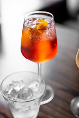 Aperitif is a refreshing cocktail of lemonade made from citrus slices. Soft drink with syrup and soda and ice cubes. Concept - summer thirst
