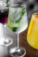 Aperitif is a refreshing cocktail of lemonade made from citrus slices. Soft drink with syrup and soda and ice cubes. Concept - summer thirst