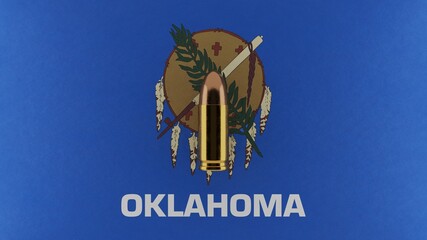 Top down view of a 9mm bullet in the center and on top of the US state flag of Oklahoma