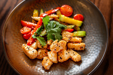 European Mediterranean salad of seasonal vegetables. Salad of tomatoes, cucumbers and fresh herbs with olive oil. Concept menu of summer cafe