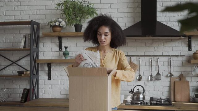 frustrated african woman customer open cardboard box receive damaged wrong parcel, problem with bad shopping order