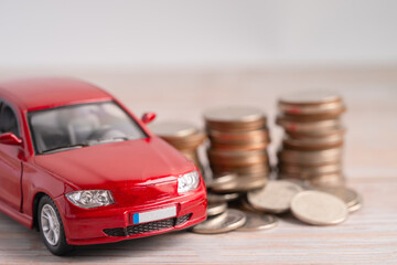 Car on coins background; Car loan, Finance, saving money, insurance and leasing time concepts.
